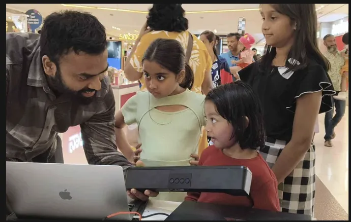 A family interacting with a Character XYZ display at Nexus Mall, Bangalore
